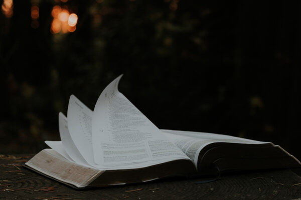 An image of an open bible. Photo Credit: UnSplash / Priscilla du Preez