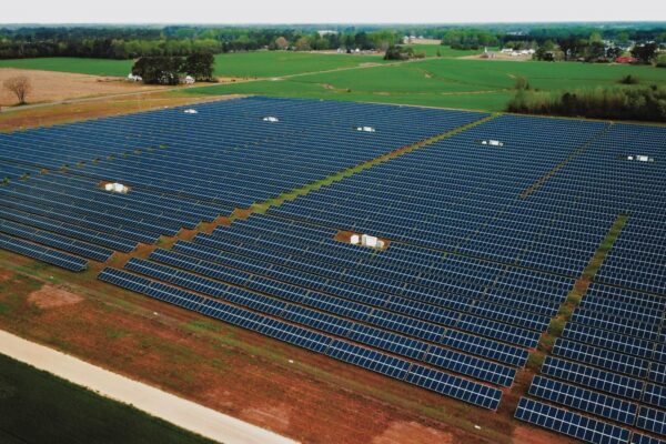 Photo of a field of solar panels.