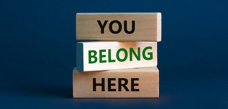 Wooden blocks with words 'You belong here'