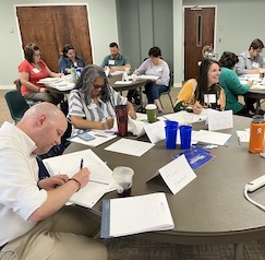 Group of ECRF participants working around a table