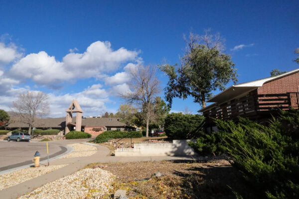 Photo of Gateway Presbyterian church and the manse (a brick house) next door.