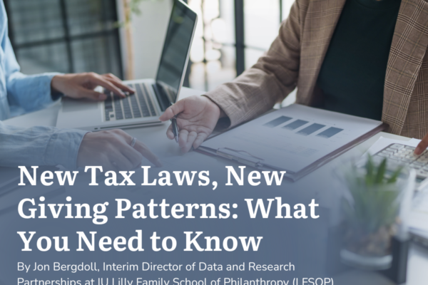 Two women working on taxes at a table